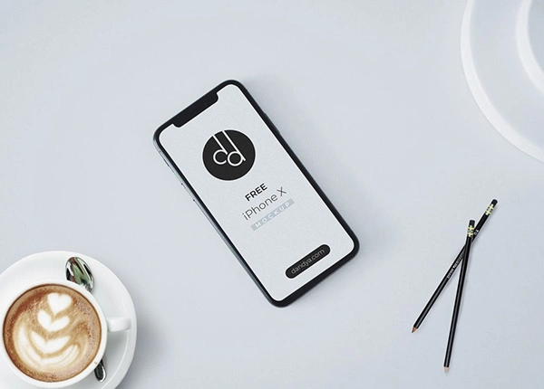 iPhone X on Table Free Mockup PSD